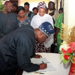 Oyo State Governor, Sen. Abiola Ajimobi; signing the condolence register; while Ekiti State Governor, Dr Kayode Fayemi; his wife, Erelu Bisi Fayemi; and wife of Oyo State Governor, Florence, watch with keen interest, during a condolence visit to the Government House, over the demise of late Deputy Governor of Ekiti State, Mrs. Funmilayo Olayinka, in Ado-Ekiti.